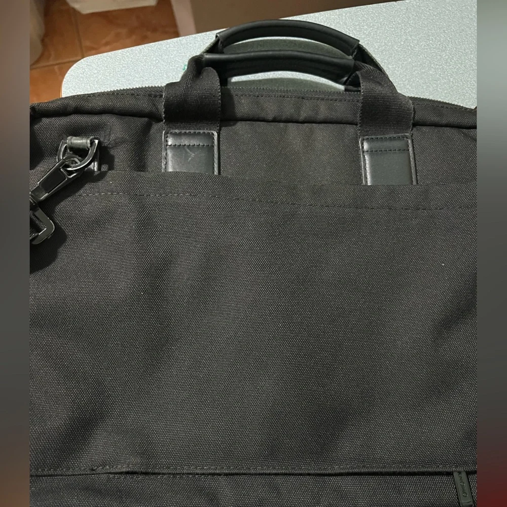 KNOMO Black Unisex Laptop Briefcase Messenger Bag with many compartments.